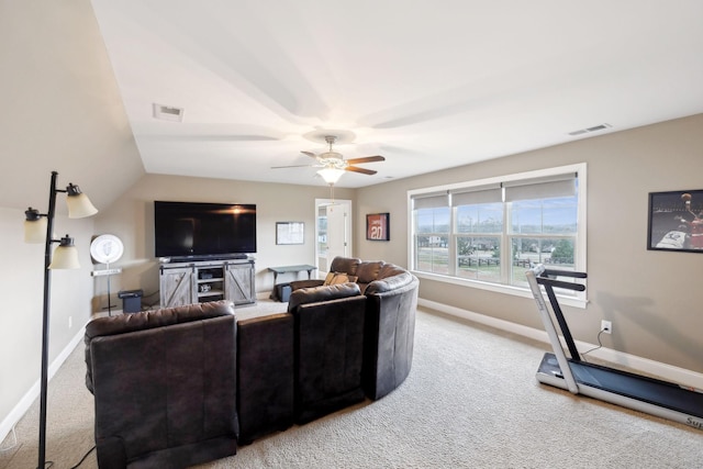 carpeted living room featuring ceiling fan