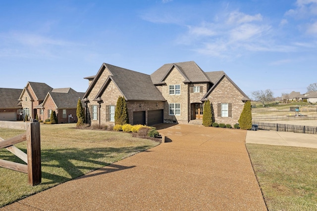 view of front facade with a garage and a front yard