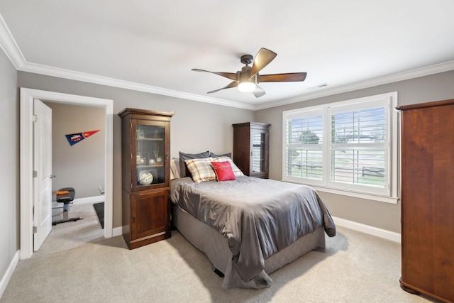 carpeted bedroom featuring ceiling fan and ornamental molding