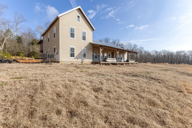 back of house with covered porch