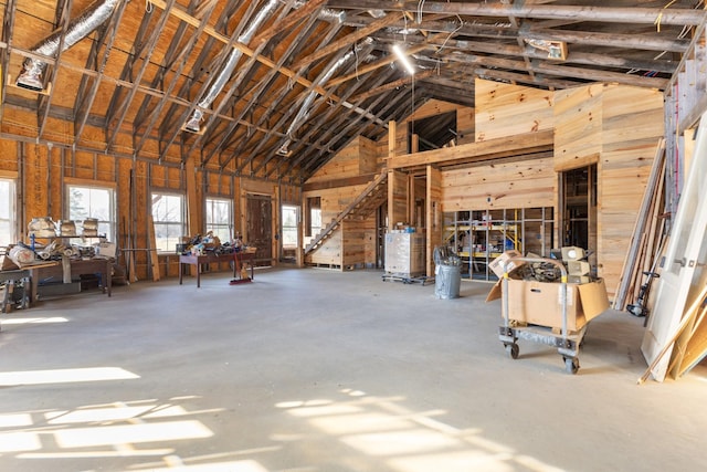 miscellaneous room with high vaulted ceiling