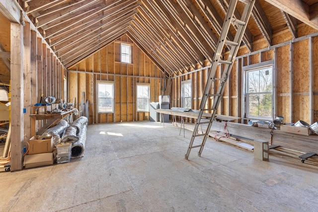 miscellaneous room with plenty of natural light and high vaulted ceiling