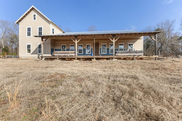 back of house with covered porch