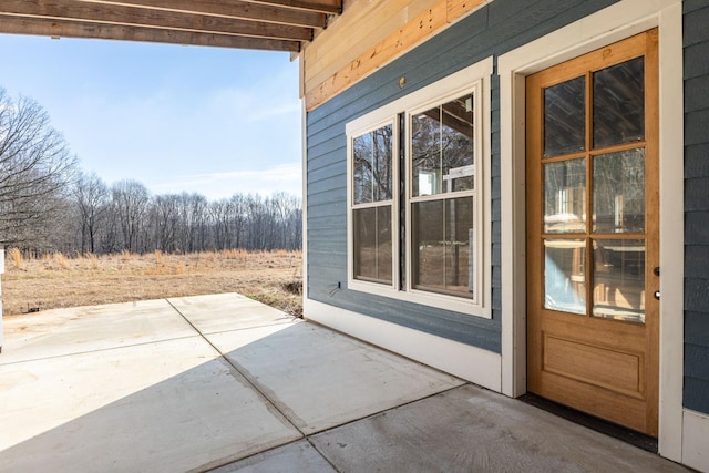 property entrance featuring a patio area