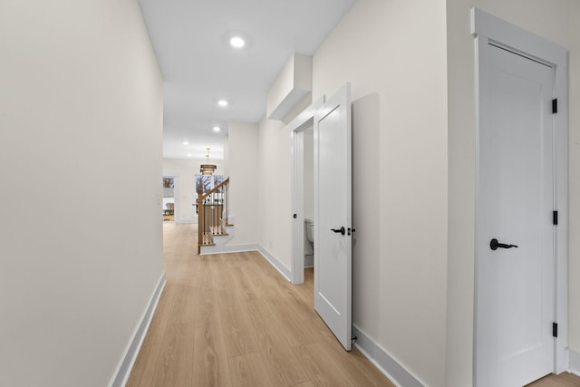 hall with light hardwood / wood-style floors