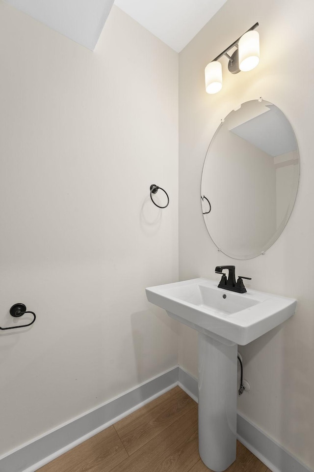 bathroom with sink and hardwood / wood-style floors