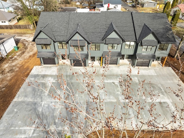 back of property with a garage