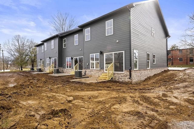 back of property featuring a patio and central air condition unit