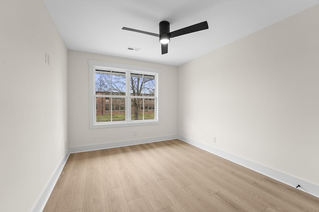 unfurnished room with ceiling fan and light wood-type flooring