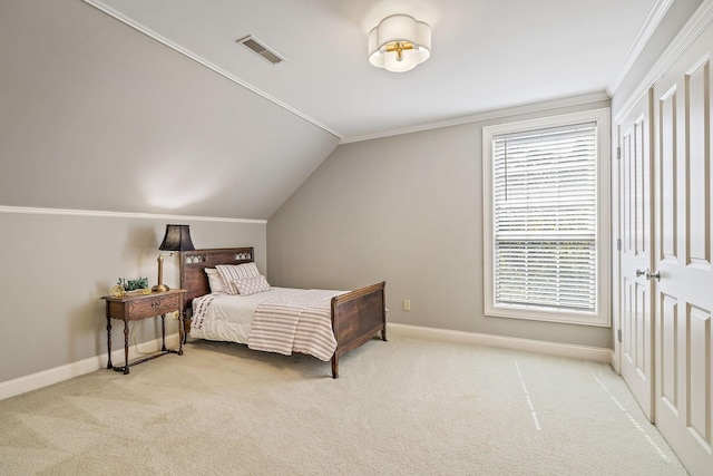 bedroom featuring ornamental molding, lofted ceiling, and light carpet