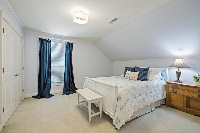 bedroom with light carpet, ornamental molding, and lofted ceiling