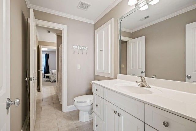 bathroom featuring vanity, crown molding, tile patterned floors, and toilet