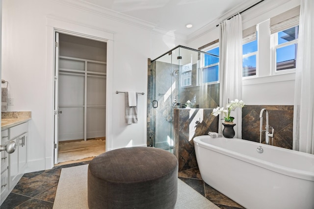 bathroom with ornamental molding, vanity, and plus walk in shower