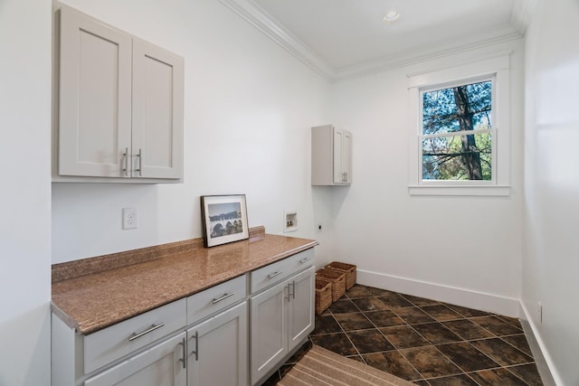 clothes washing area with cabinets, ornamental molding, washer hookup, and hookup for an electric dryer