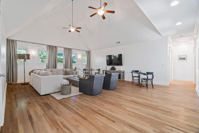 living room with ceiling fan, high vaulted ceiling, and light hardwood / wood-style flooring