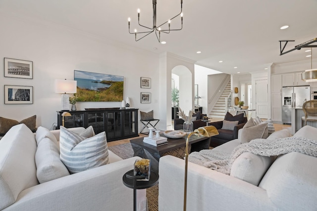 living room with hardwood / wood-style flooring and crown molding