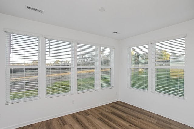 spare room featuring dark hardwood / wood-style floors