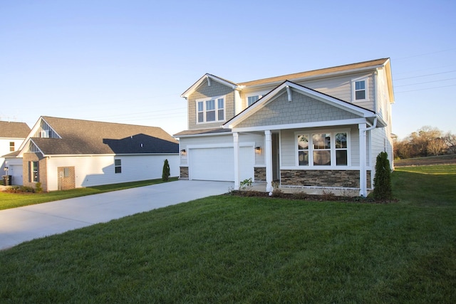 view of front of property featuring a garage and a front lawn