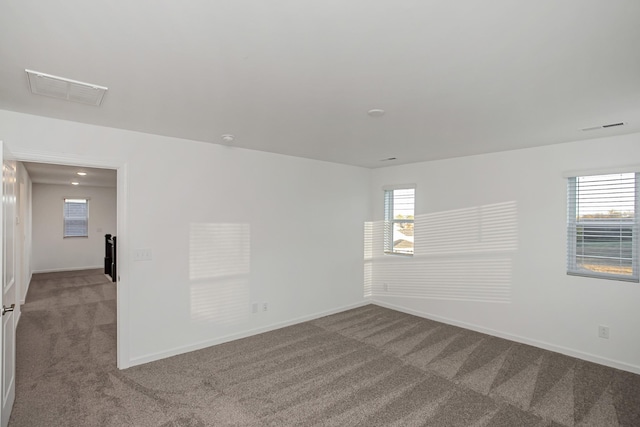 unfurnished room featuring carpet flooring