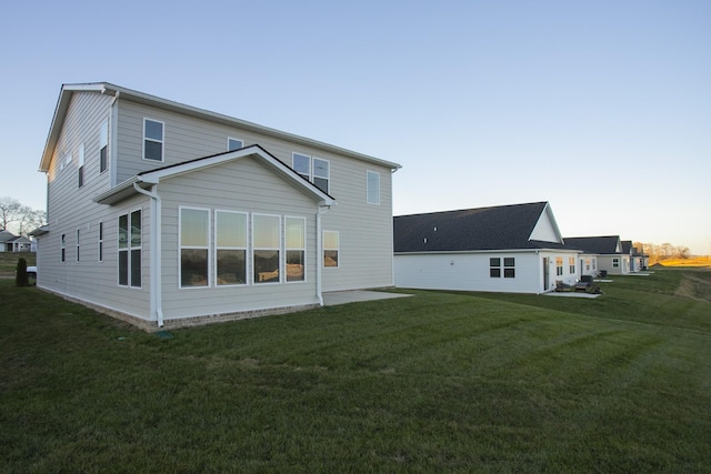 back of house featuring a yard