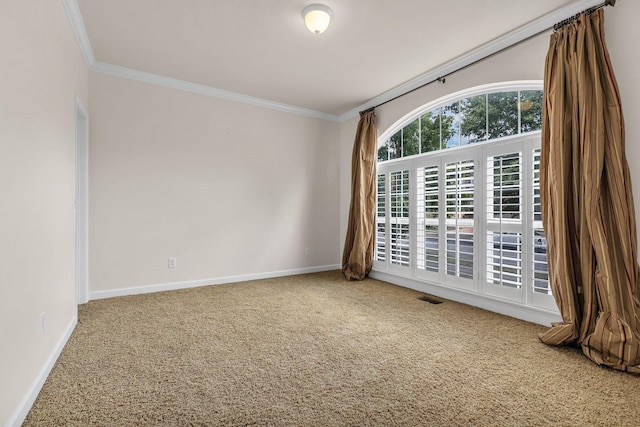 carpeted spare room with ornamental molding