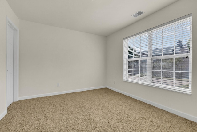 spare room featuring carpet floors