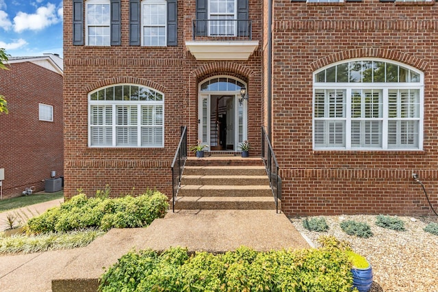 doorway to property featuring cooling unit