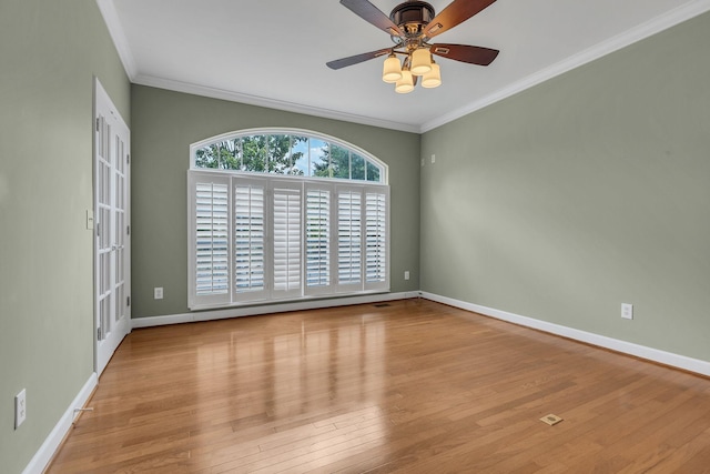 spare room with crown molding, ceiling fan, and light hardwood / wood-style floors