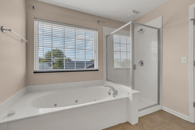 bathroom with tile patterned floors and plus walk in shower