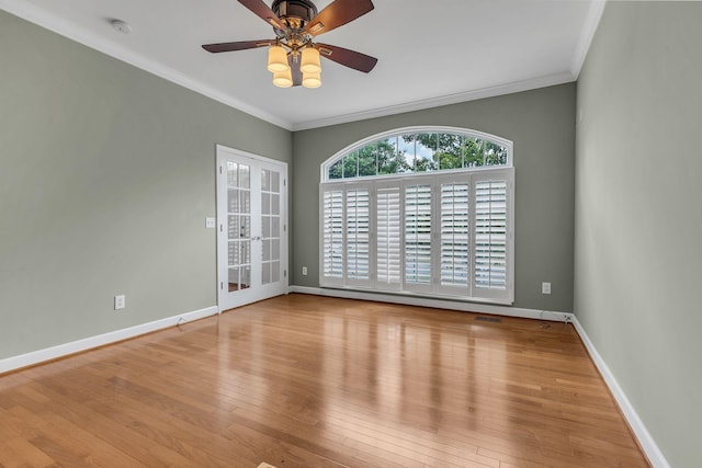 unfurnished room featuring crown molding, ceiling fan, and light hardwood / wood-style flooring