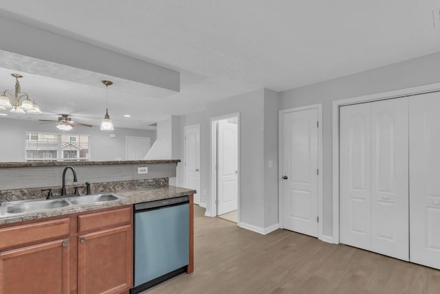 kitchen with dishwasher, sink, hanging light fixtures, ceiling fan, and light hardwood / wood-style floors