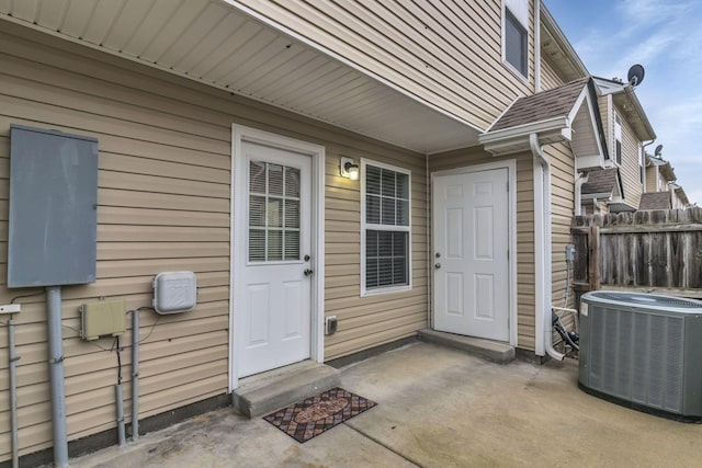 doorway to property featuring central AC and a patio area