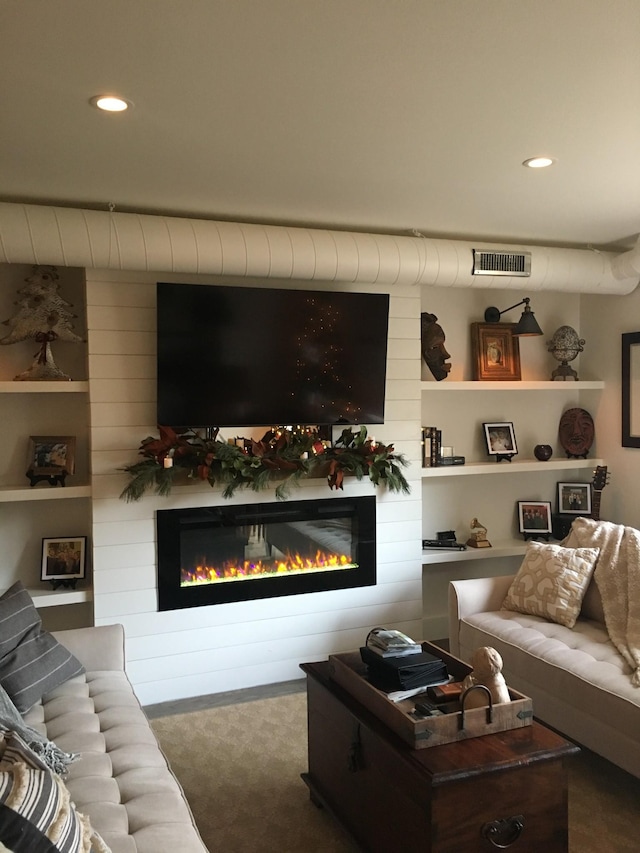 living room featuring dark carpet