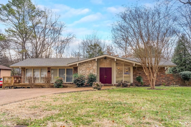 ranch-style house with a front lawn