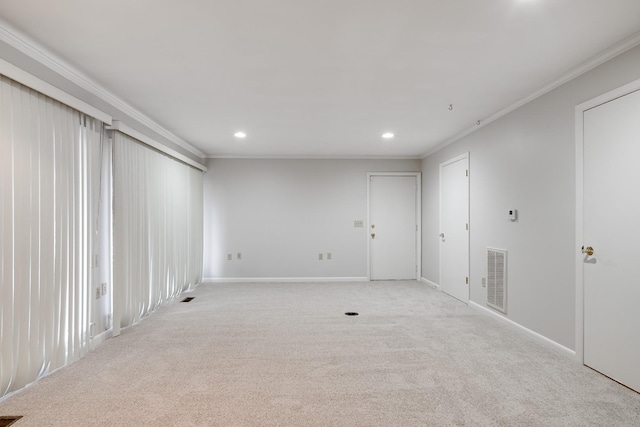 carpeted empty room with crown molding