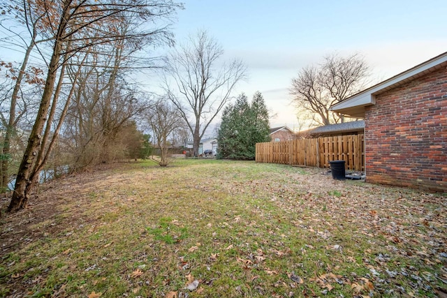 view of yard at dusk