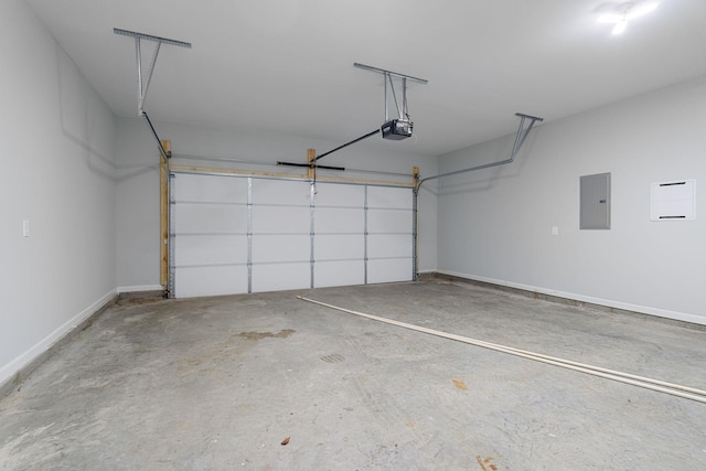 garage featuring a garage door opener and electric panel