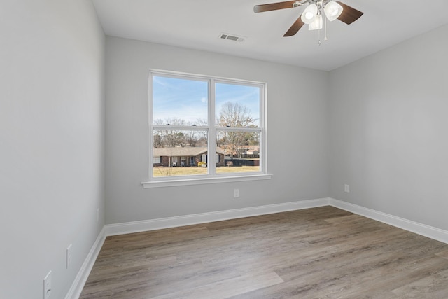 empty room featuring ceiling fan and light wood-type flooring