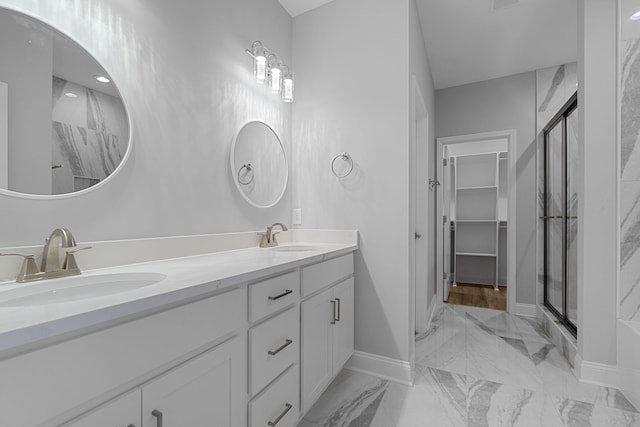 bathroom with vanity and walk in shower