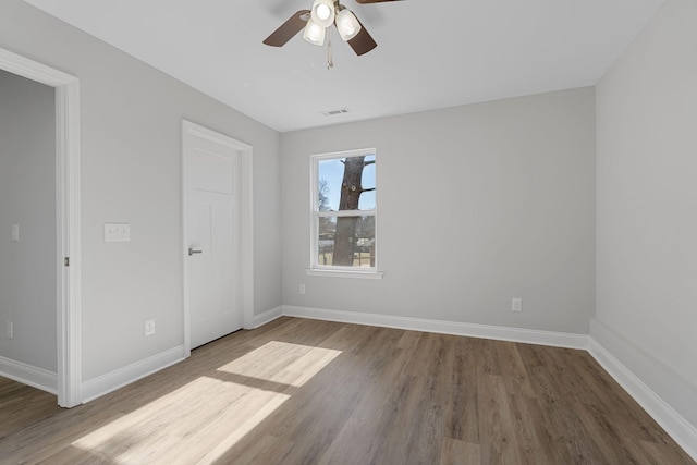 unfurnished bedroom with ceiling fan and wood-type flooring