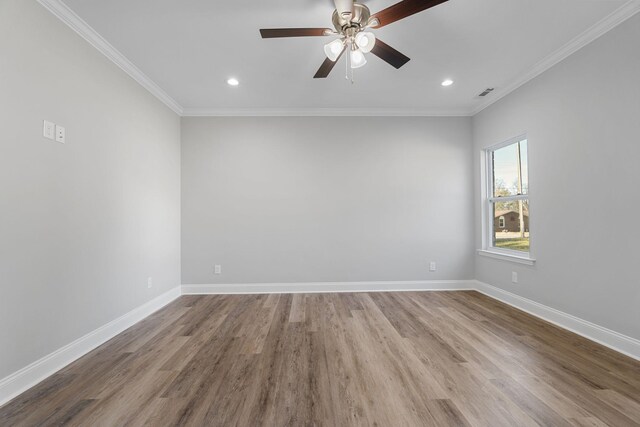 empty room with ornamental molding, ceiling fan, and light hardwood / wood-style flooring