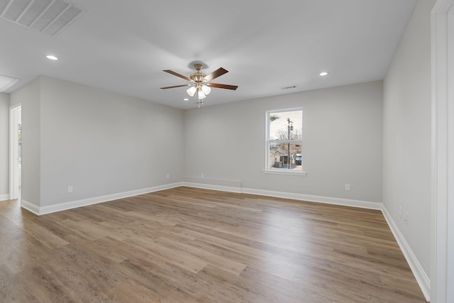 spare room with ceiling fan and light hardwood / wood-style flooring