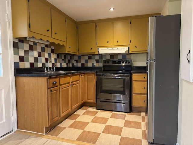 kitchen with sink, backsplash, and stainless steel appliances