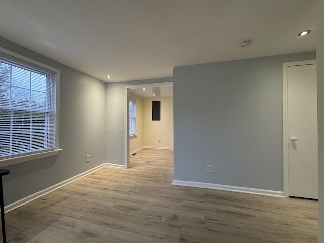 unfurnished room featuring light wood-type flooring