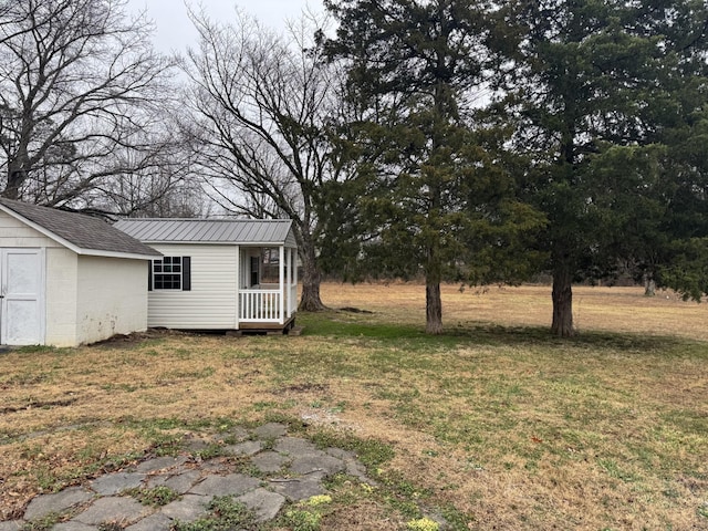 view of yard featuring covered porch