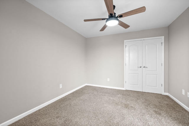 unfurnished bedroom with a closet, ceiling fan, and carpet