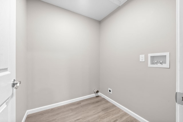 laundry area featuring hookup for an electric dryer, washer hookup, and light hardwood / wood-style flooring