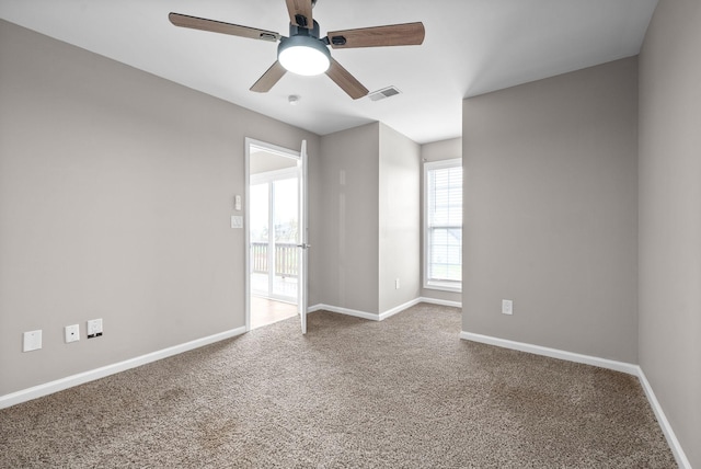 empty room with carpet and ceiling fan