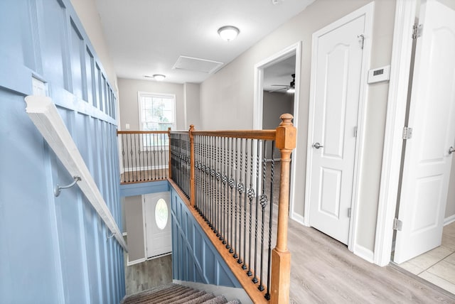 stairway with hardwood / wood-style flooring