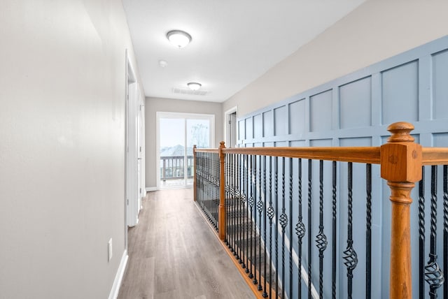 corridor featuring hardwood / wood-style floors